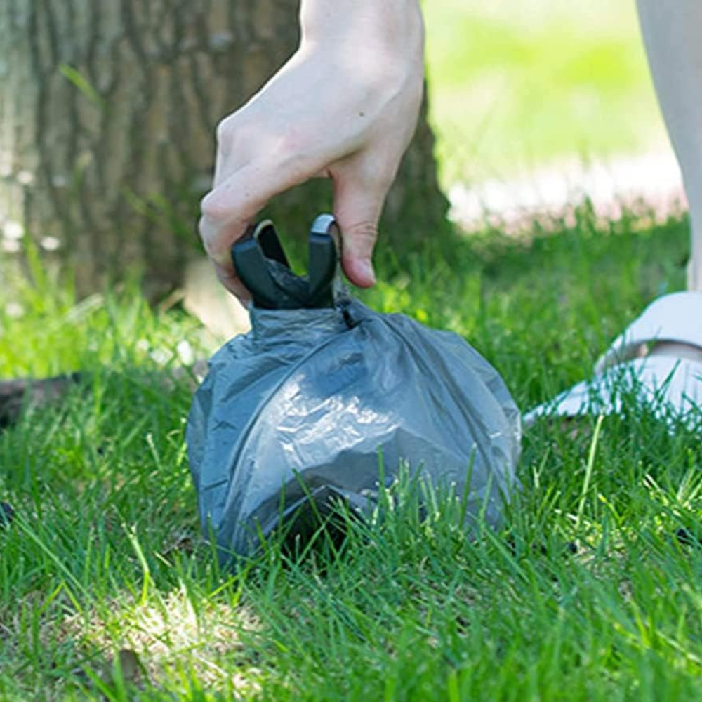 Collapsible Dog Pooper Scooper with Biodegradable Waste Bags - in use
