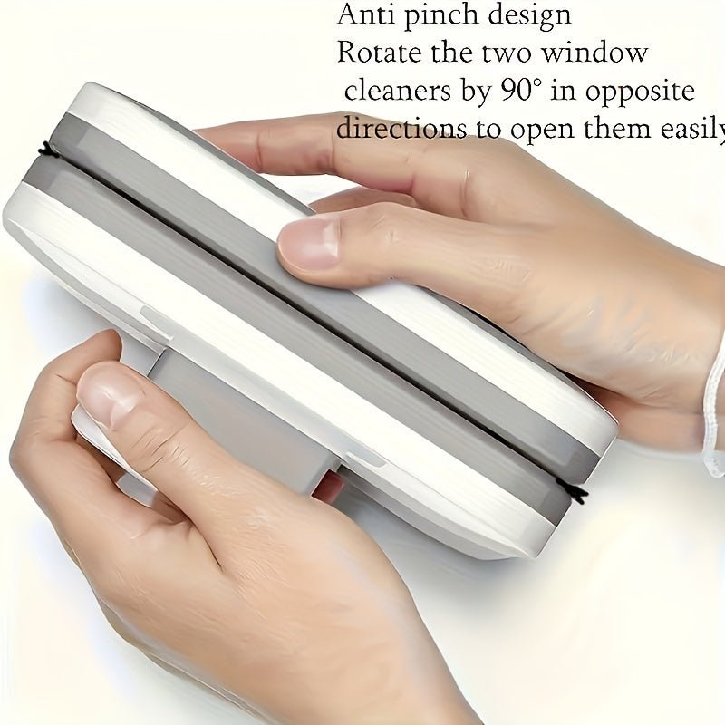 Double-sided magnetic window squeegee for double glazing - in use