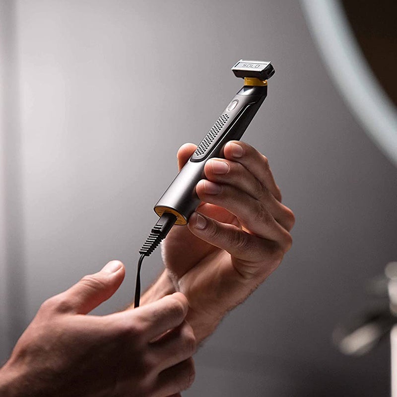 Cordless rechargeable precision shaver - in use