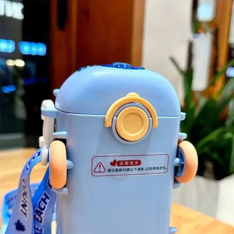 Cartoon Toy Bus Water Bottle with Straw - in use